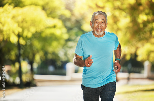 Portrait, summer and an old man running in the park for fitness, cardio training or a marathon. Exercise, smile and a happy senior runner outdoor for a workout to improve health or wellness on space