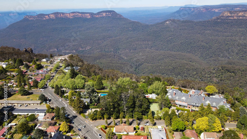Aerial drone view of Echo Point Lookout and the Three Sisters rock formation at Katoomba in the Blue Mountains region, New South Wales, Australia on a sunny day in September 2023    photo