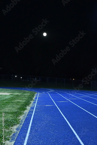 Full Moon Over a Running Track