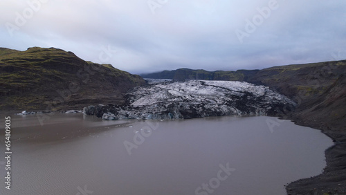 Aerial view of the Solheimajokull is an outlet glacier of the mighty icecap of Myrdalsjokull on the South Coast of Iceland. It is the fourth-largest ice cap in Iceland. photo