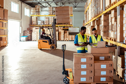 Wide angle view of diverse workers in a warehouse photo