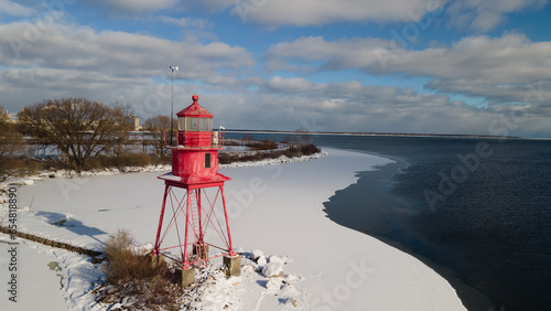 Alpena, Michigan historic lighthouse along Lake Huron in the winter.