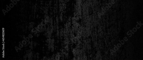 Abstract structured black concrete wall background, scary black grunge goth design, black wall background of natural paintbrush stroke textured cement or stone old.