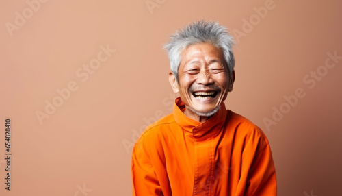 Studio portrait of a happy asian man 