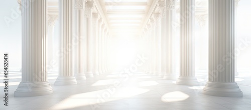 Obraz na plátně Sunlight filters through pillars in a lengthy bright hallway with copyspace for