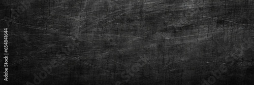 Black Scratched Abstract Background  A grainy  rough texture in deep shades unveils a captivating canvas for a web banner  infusing richness and depth into your online visual narrative