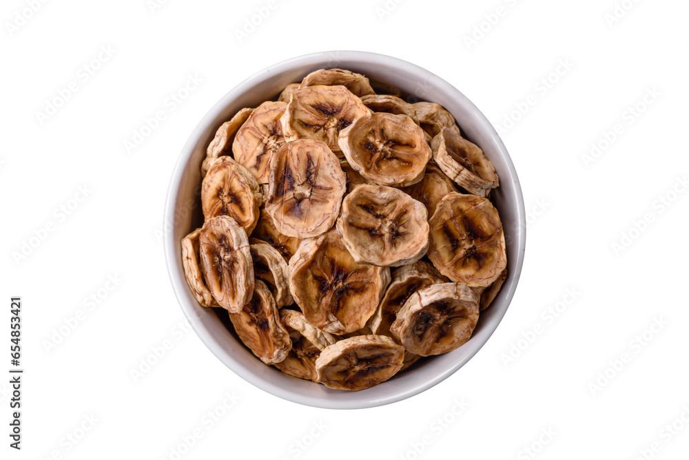 Round slices of sweet banana on a dark concrete background Round slices of sweet banana on a dark concrete background