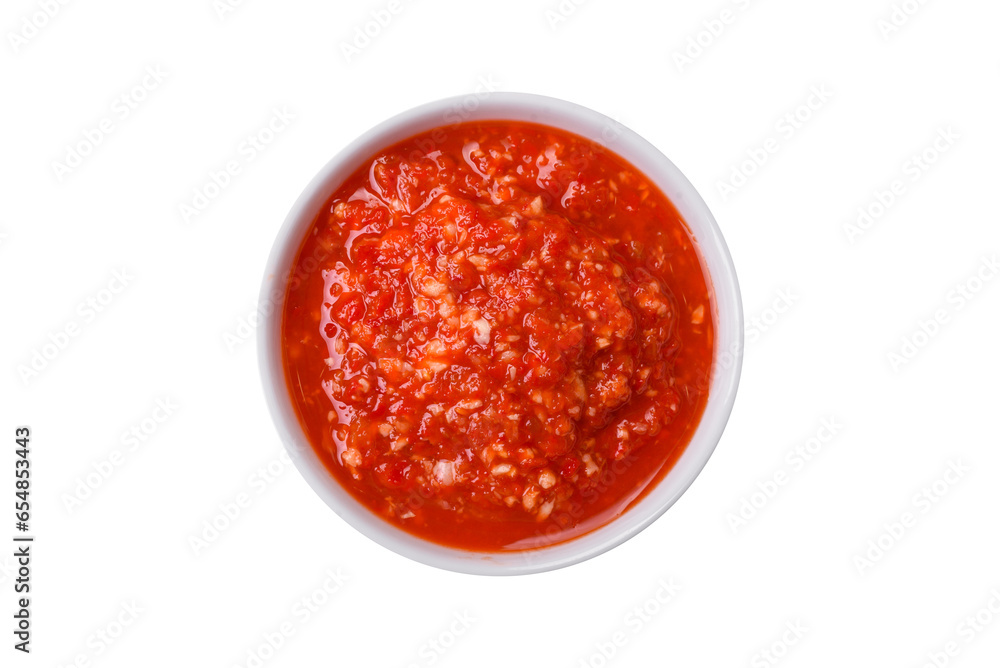 Delicious hot spicy red sauce with salt and spices in a ceramic bowl Delicious hot spicy red sauce with salt and spices in a ceramic bowl