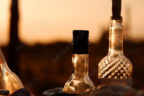 Winebottles and sunset photo