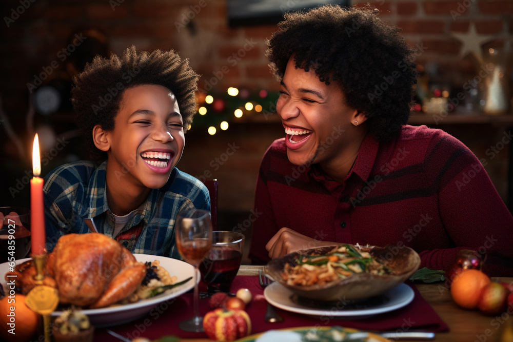 A photo of an african american mother and son smiling at each other during thanksgiving dinner, happy thanksgiving photo