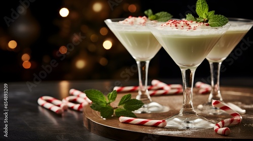 Close up of two White Russian Drinks in Cocktail Glasses topped with Peppermint. Festive Backdrop
