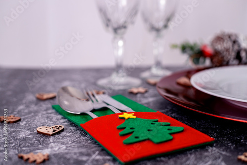 Nice Christmas table setting on black and white background, top view