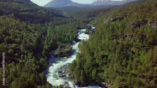 Aerial view of a mountain river in Norway. Beautiful summer landscape (camera down). photo