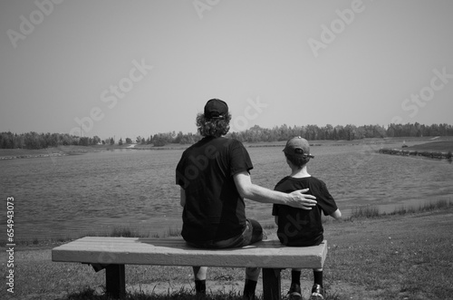 Son and Dad sitting on a bench