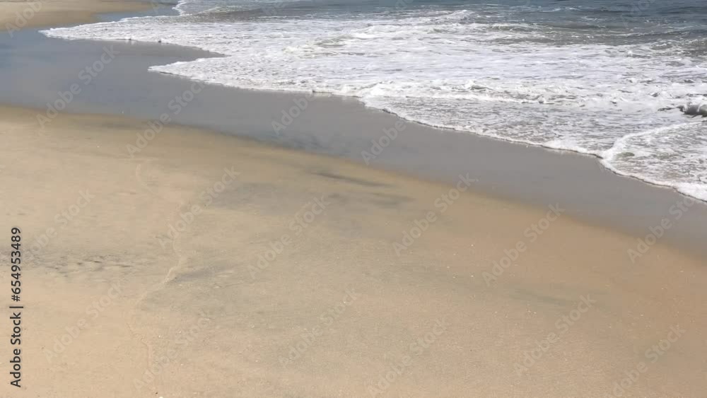 The wave foam on the beach The wave foam on the beach
