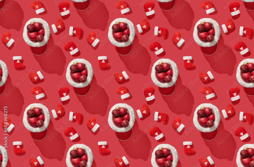 Pattern of red Santa's boot on red pastel background Pattern of red Santa's boot on red pastel background