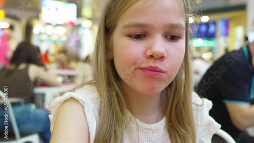 Wallpaper Mural A teenage girl eats fast food in a cafe.  Torontodigital.ca