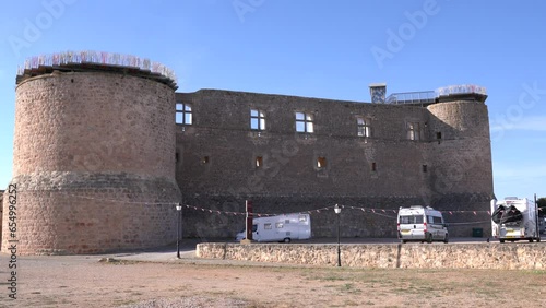 Motorhome driving away from spanish aire next to castle Castillo de Garcimunoz Cuenca, Castile-La Mancha, Spain