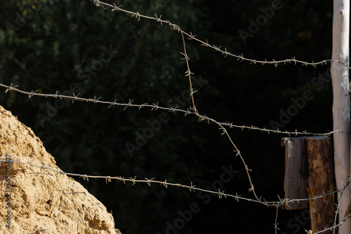 Barbed wire on a black background close-up