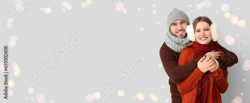 Happy young couple in winte...