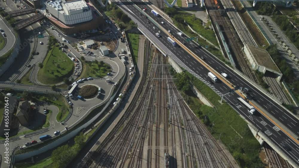 Aerial view of railway hub with passenger and freight trains near the Fiera-Milano station in Milan, Italy. Aerial view of railway hub with passenger and freight trains near the Fiera-Milano station in Milan, Italy.