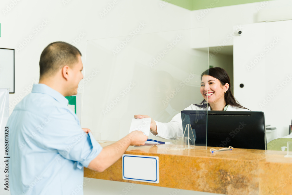 Happy patient in the medical lab receiving his test results Happy patient in the medical lab receiving his test results