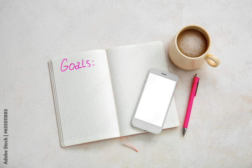 Notebook with empty to do list, cup of coffee and mobile phone on white grunge background. New year goals Notebook with empty to do list, cup of coffee and mobile phone on white grunge background. New year goals