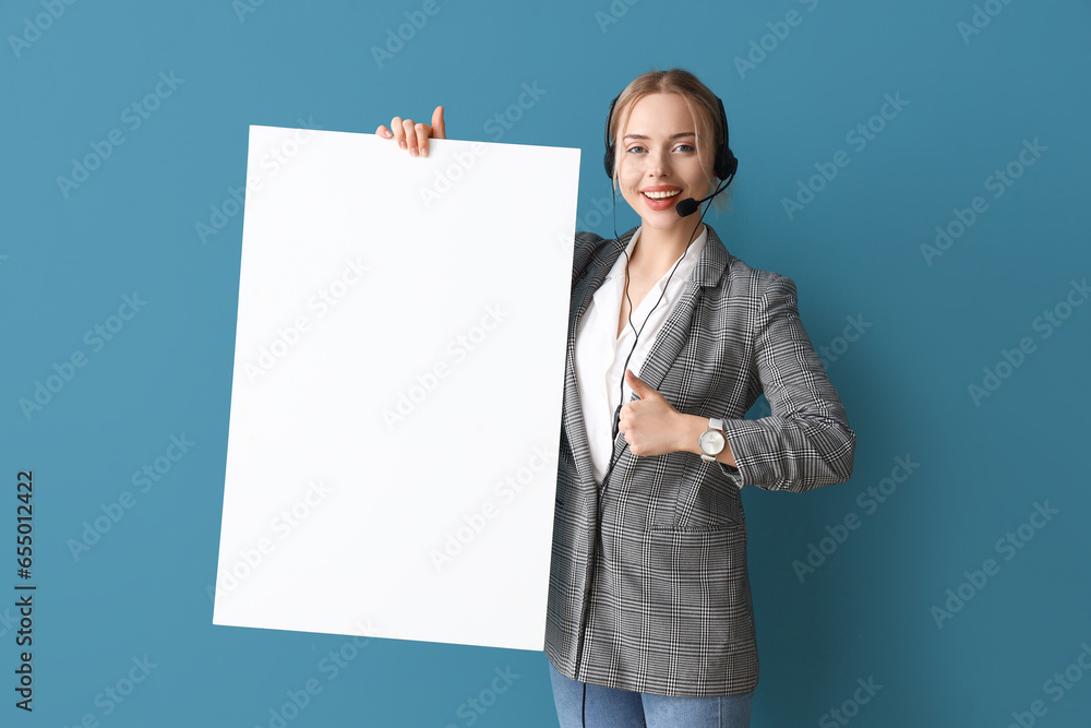 Female technical support agent with blank poster on blue background Female technical support agent with blank poster on blue background