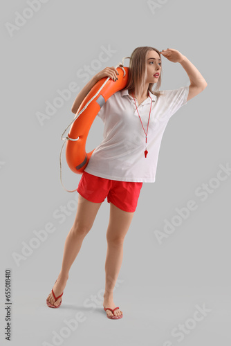 Female lifeguard with ring ...
