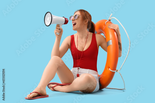 Female lifeguard with ring ...
