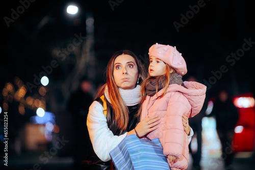 Tired Mother and Daughter Shopping together During Holidays. Exhausted mom and child feeling desperate from Xmas rush 
