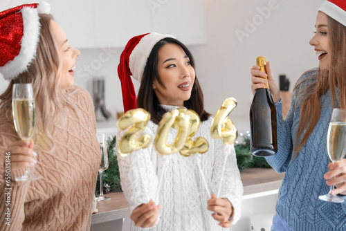 Diverse young women celebra...