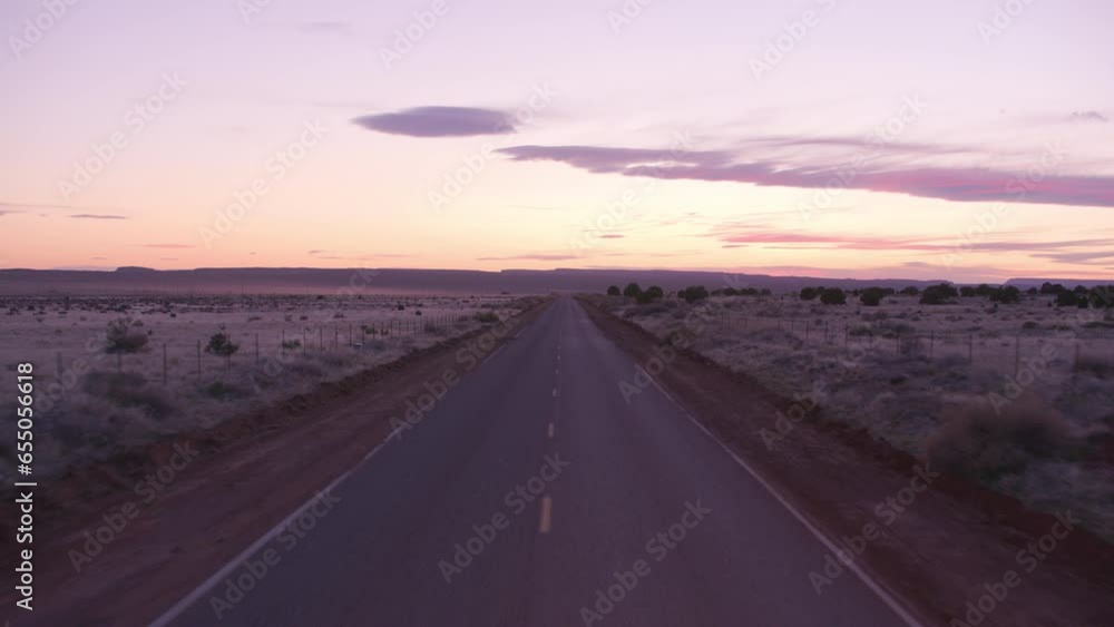 Driving down desert road, automobile point of view. Driving down desert road, automobile point of view.