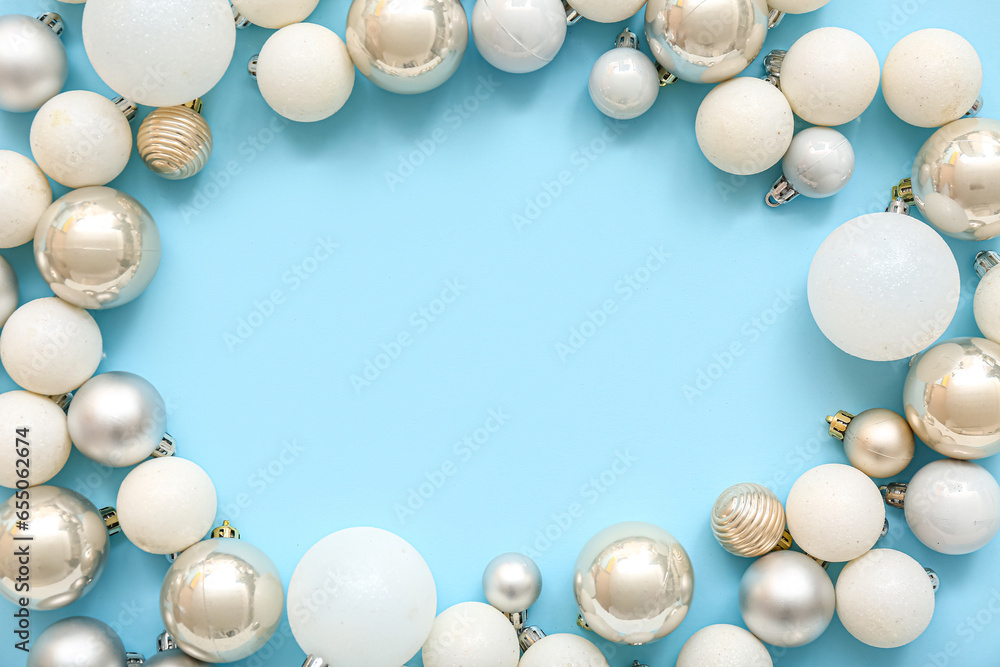 Frame made of Christmas balls on blue background Frame made of Christmas balls on blue background