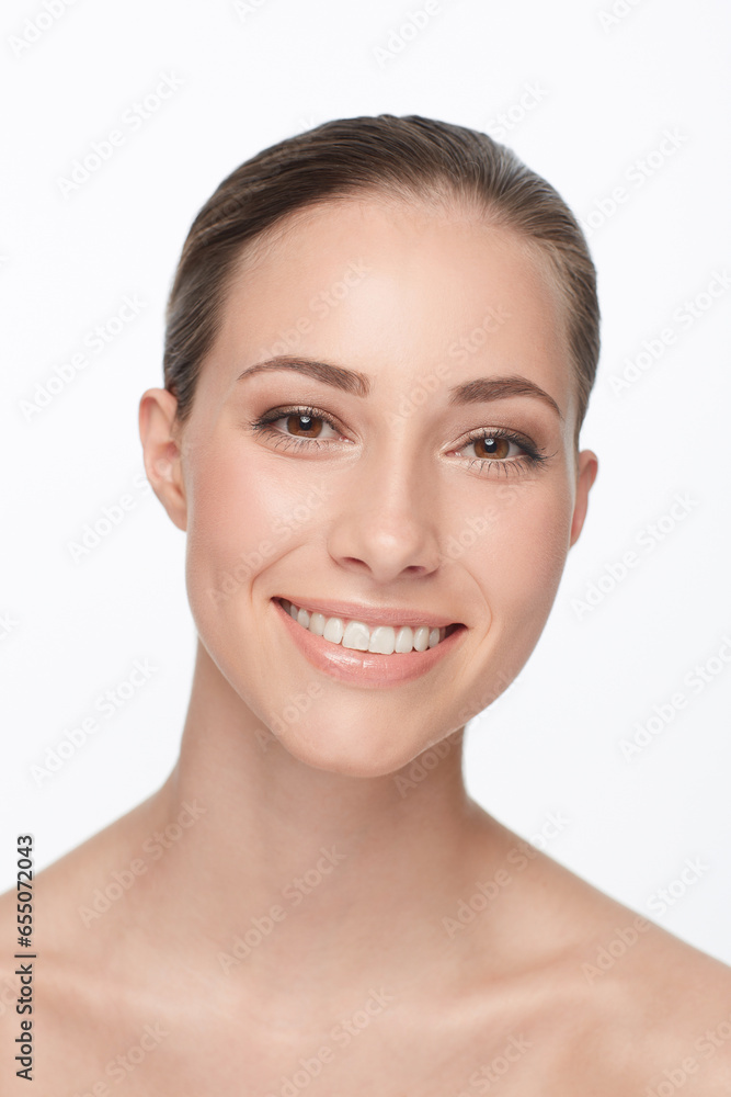 Woman, smile and studio portrait for beauty or cosmetic results, glow or makeup routine. Female model, face and nude wellness natural look for happiness, white background or clean skin dermatology Woman, smile and studio portrait for beauty or cosmetic results, glow or makeup routine. Female model, face and nude wellness natural look for happiness, white background or clean skin dermatology