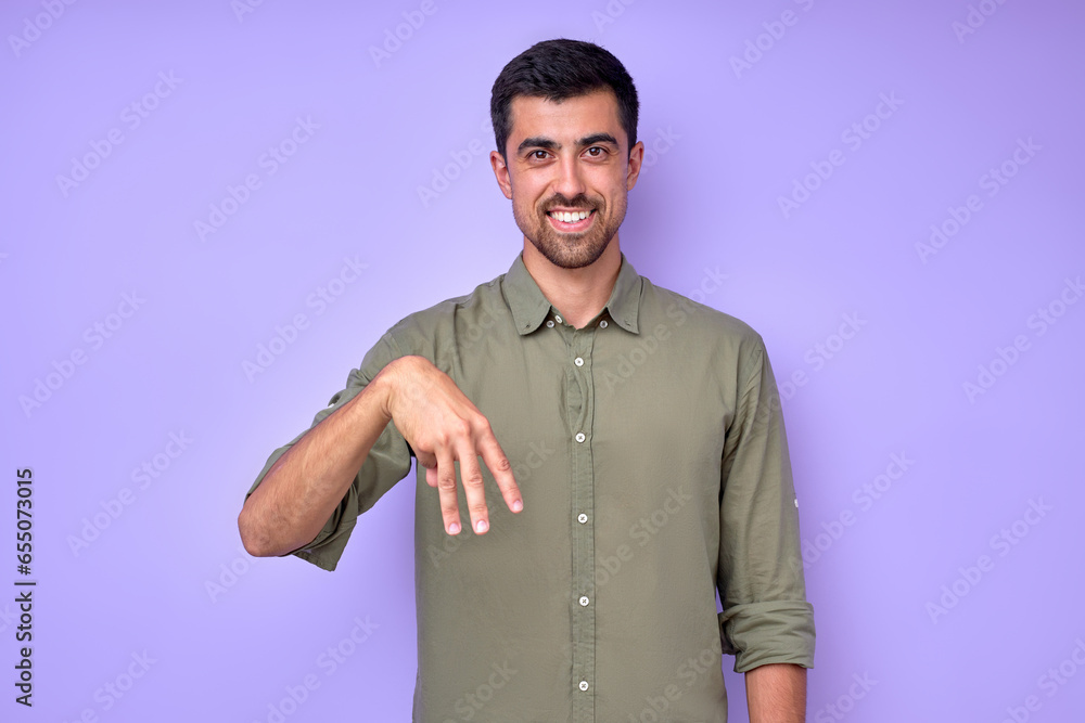 cheerful brunette bearded man demonstrating the letter M m . sign language symbol for deaf human in blue background. isolated cheerful brunette bearded man demonstrating the letter M m . sign language symbol for deaf human in blue background. isolated
