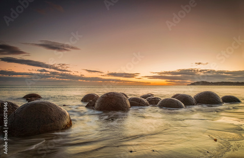 Schilderij op canvas The famous Moeraki Boulders, an icon of New Zealand, in Otago, at sunrise