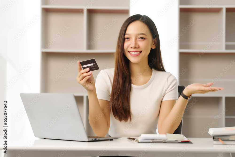 Determined Asian chinese people housewife using calculator and credit cards to keep track of her family's expenses and budget. Housewife Managing Household Expenses and Credit Cards Determined Asian chinese people housewife using calculator and credit cards to keep track of her family's expenses and budget. Housewife Managing Household Expenses and Credit Cards