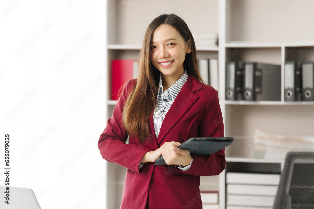 Asian people independent investment consultant captured in her element at office, donning vibrant red business suit. Her poised demeanor epitomizes blend of tradition modernity in today finance world Asian people independent investment consultant captured in her element at office, donning vibrant red business suit. Her poised demeanor epitomizes blend of tradition modernity in today finance world