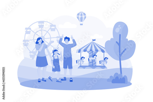 Family visits an amusement park for morning fun.
