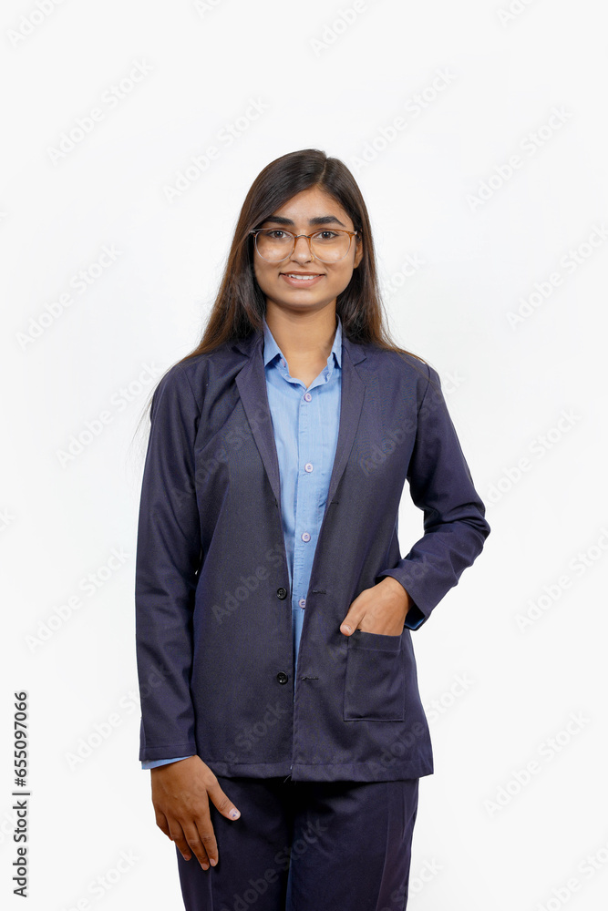 Young Asian woman professional businesswoman standing, beaming and appearing assured against a white background. Young Asian woman professional businesswoman standing, beaming and appearing assured against a white background.