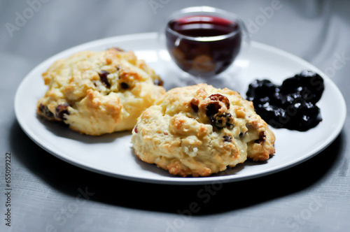 scone with berry sauce and berry juice