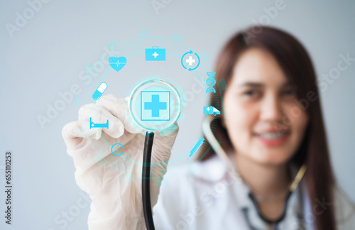 Doctor holding helioscope with icon of healthcare, Concept  Principles of health insurance and maintaining health health monitoring. photo