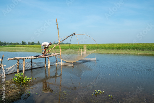 Fishing with Vesal, Tributary of Tista River, Bangladesh photo