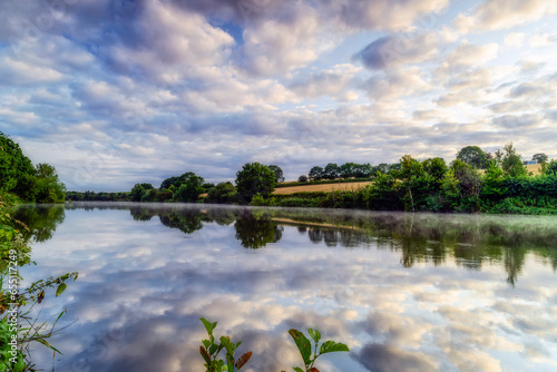 Fantastic reflection of the clouds on the surface of the lake, Ulley Reservoir photo