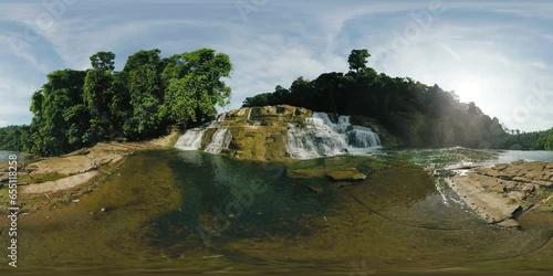 Waterfalls create spash and mist surrounded by tropical forest. Tinuy-an Falls. Surigao del Sur. Philippines. VR 360. photo