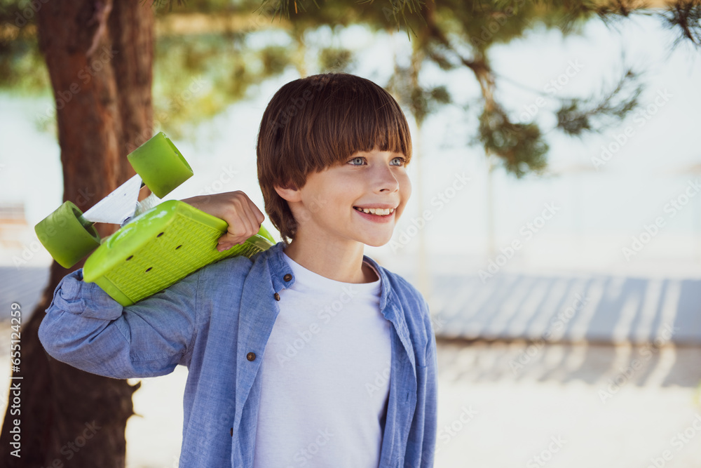 Smile, skateboard and portrait of child boy with skateboarding hobby ...