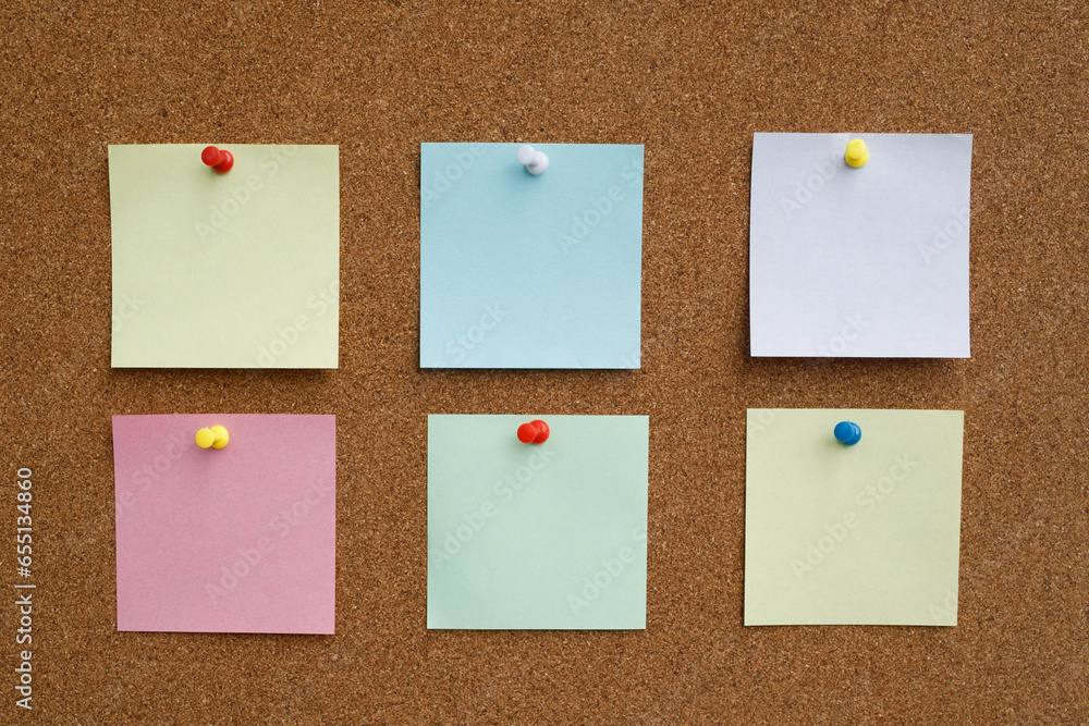 collection of colorful variety post it. paper note reminder sticky notes  pin on cork bulletin board. empty space for text. Stock Photo