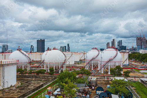 White spherical propane tanks containing fuel gas storm