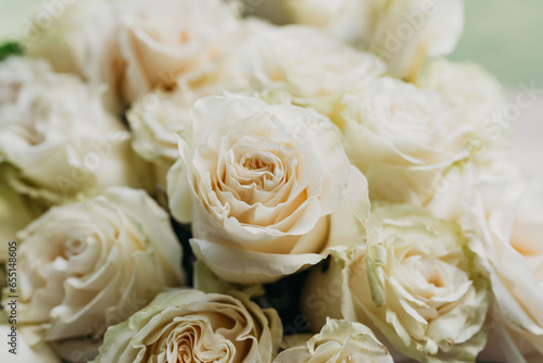 Flower composition of light beige roses  close up.